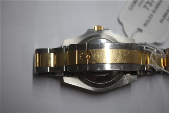 A gentlemens stainless steel and yellow gold Rolex Oyster Perpetual Date Submariner wrist watch,